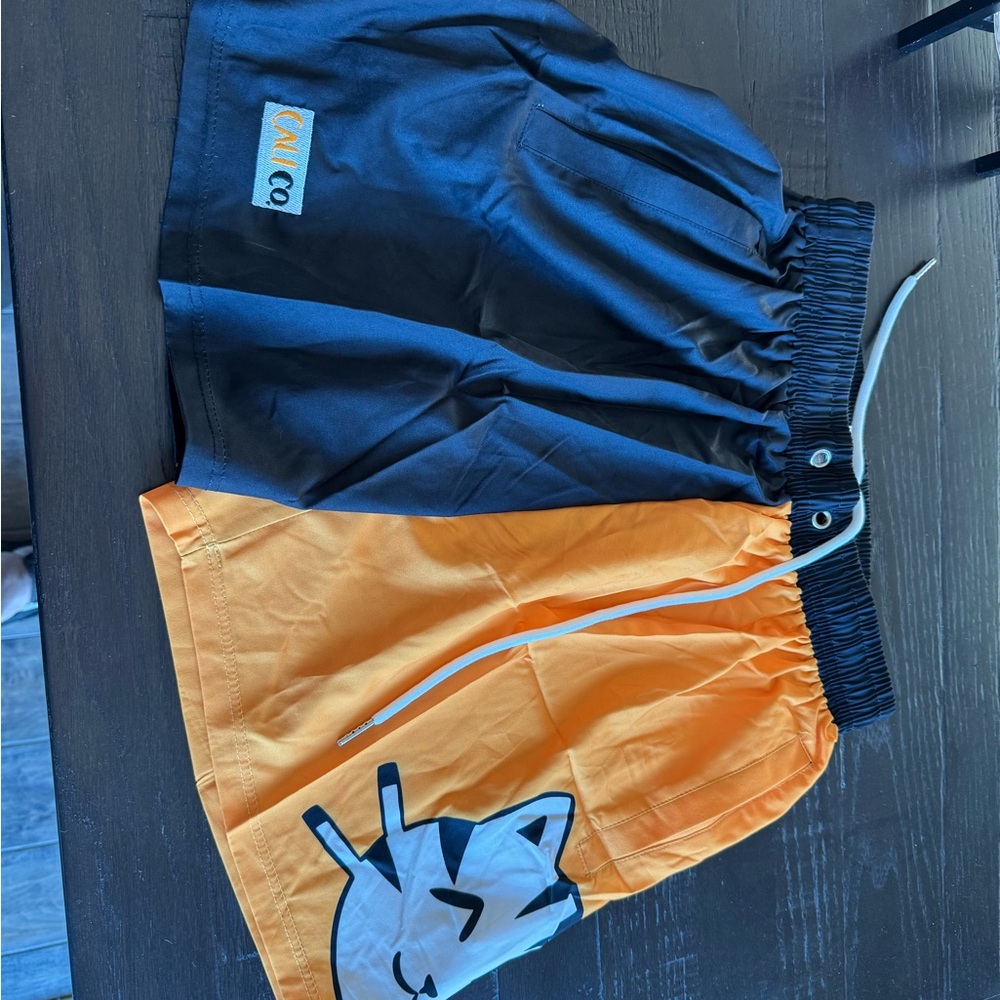 CaliCo Women's Black and Orange Athletic Shorts, size Medium